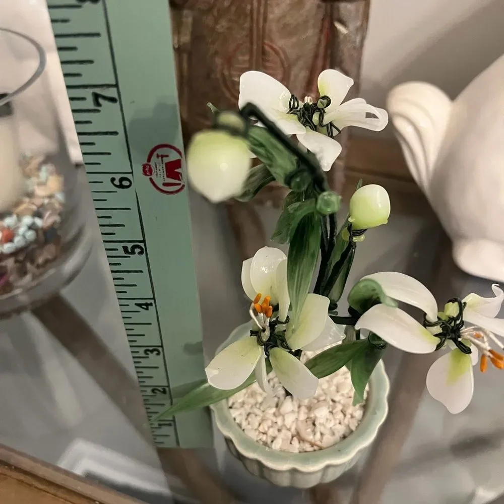 Vintage jade quartz tree in celadon pot. White and Green Plant.